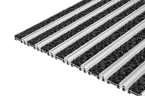 Top Clean TREND WAVE: Die Top Clean TREND WAVE mit der WAVE-Einlage aus 100% Polyamid ist eine strapazierfähige Eingangsmatte für den Außenbereich.